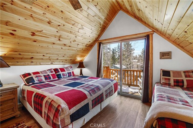 bedroom with wood ceiling, access to outside, vaulted ceiling, and wood-type flooring