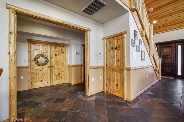 entryway with wood ceiling