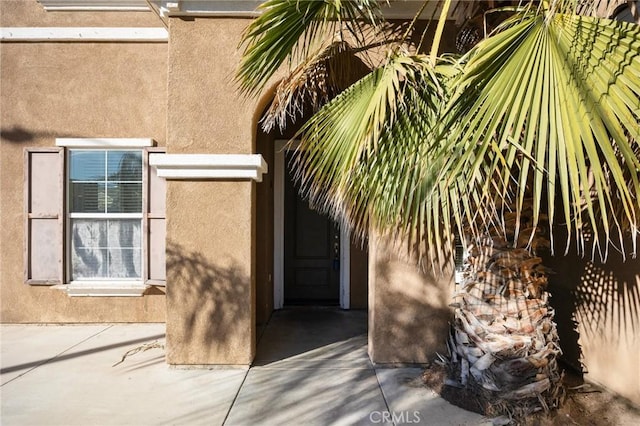 property entrance with a patio