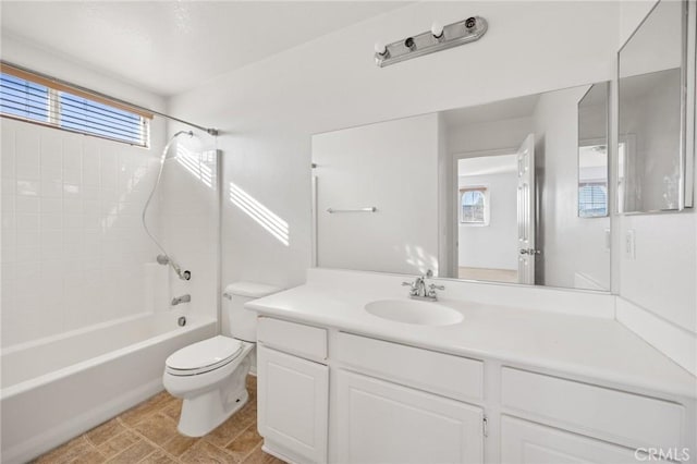 full bathroom featuring shower / bathing tub combination, vanity, and toilet