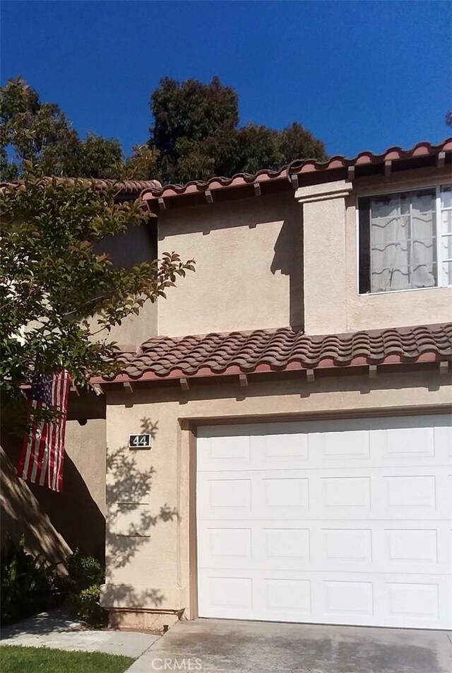 view of property exterior featuring a garage