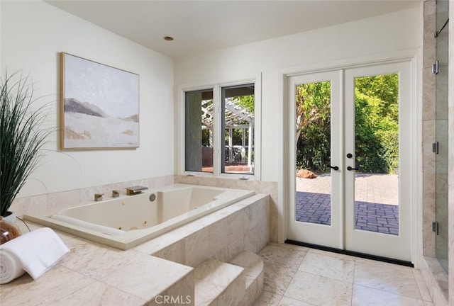 bathroom with a whirlpool tub, french doors, and a stall shower