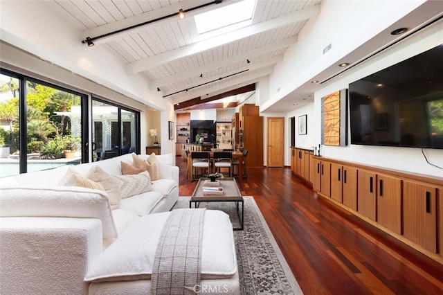 living room with dark wood-type flooring, vaulted ceiling with skylight, and wooden ceiling