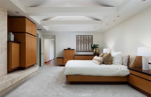 bedroom featuring recessed lighting, light colored carpet, and a tray ceiling