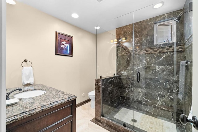 bathroom featuring toilet, an enclosed shower, and vanity