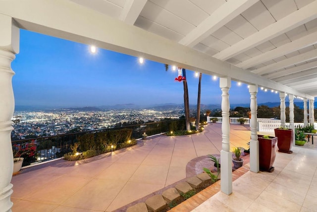 view of patio terrace at dusk