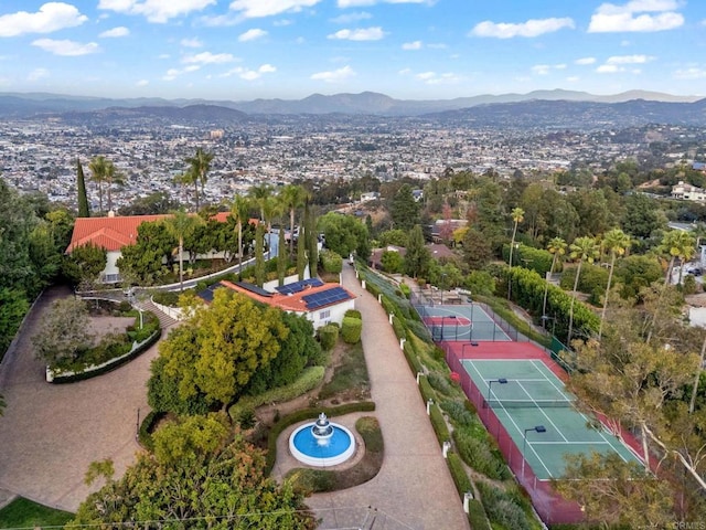 birds eye view of property with a mountain view