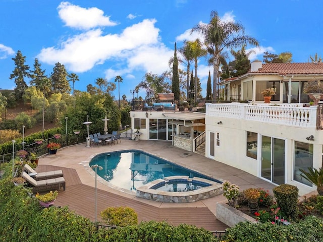 view of pool featuring an in ground hot tub and a patio area