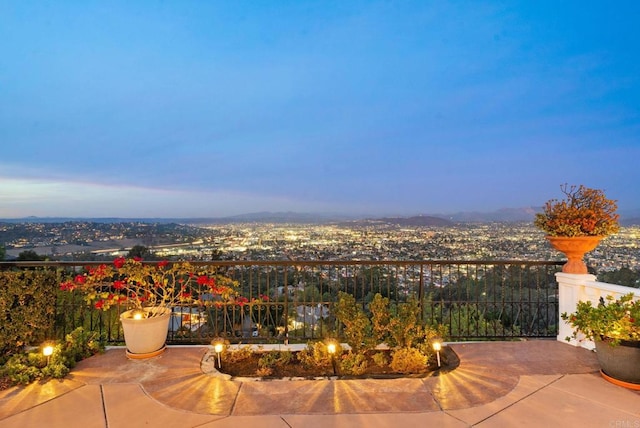 view of patio terrace at dusk