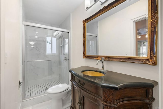 bathroom featuring toilet, ceiling fan, walk in shower, and vanity