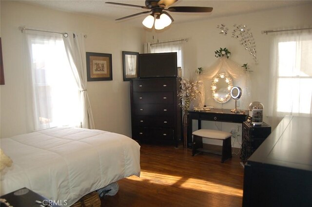 bedroom with ceiling fan and wood-type flooring