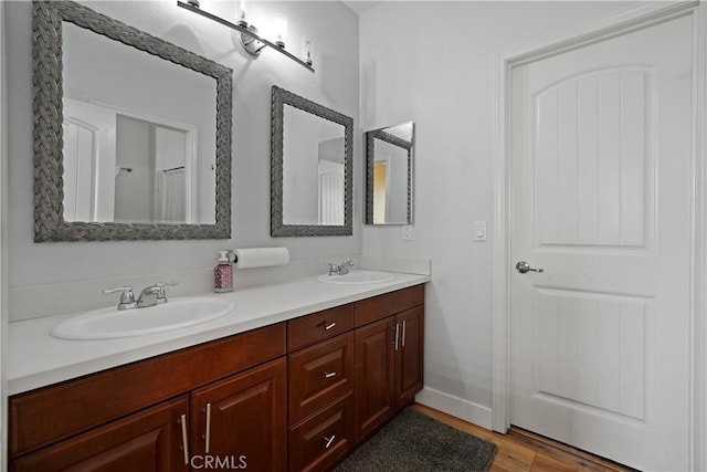 bathroom featuring vanity and wood-type flooring