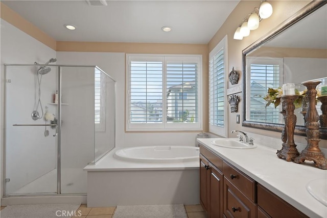 bathroom featuring separate shower and tub, tile patterned floors, and vanity