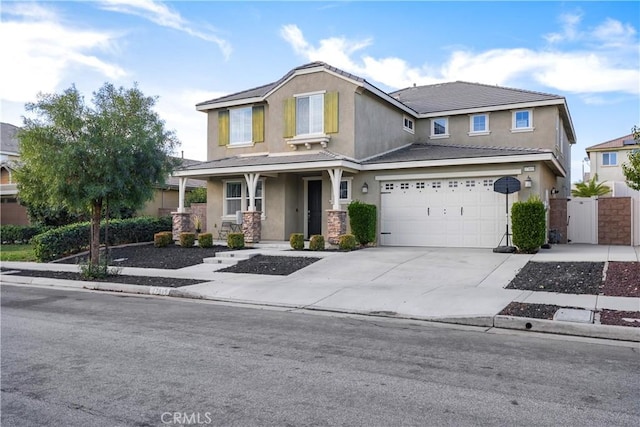 view of front of property featuring a garage