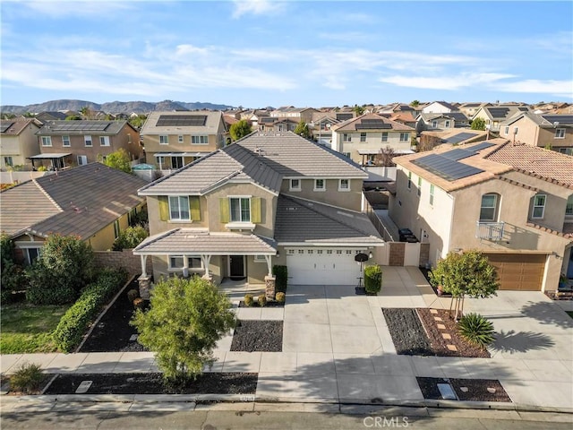 birds eye view of property featuring a mountain view