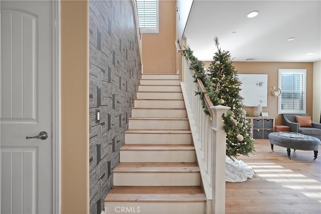 stairs featuring wood-type flooring