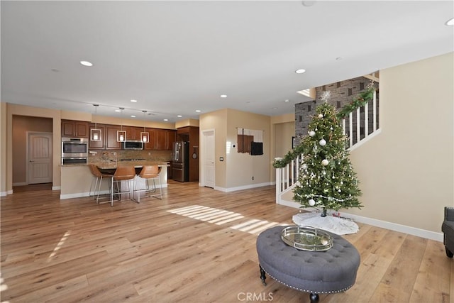 unfurnished living room with light hardwood / wood-style floors