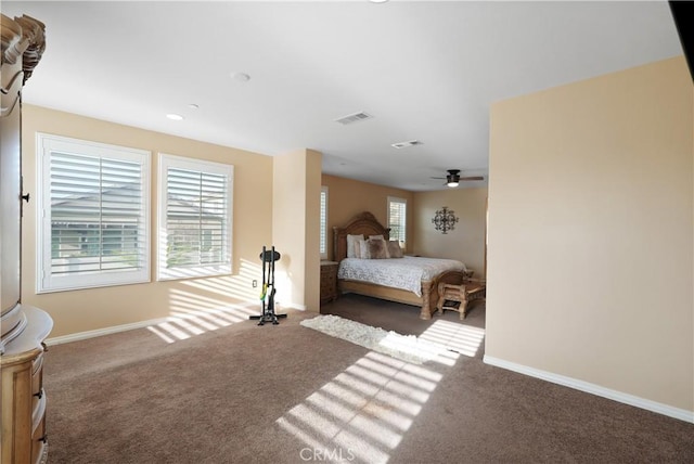 bedroom with dark colored carpet