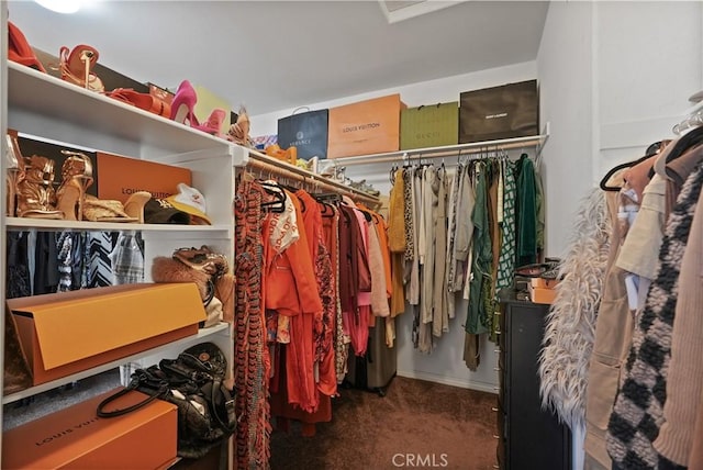 walk in closet with carpet