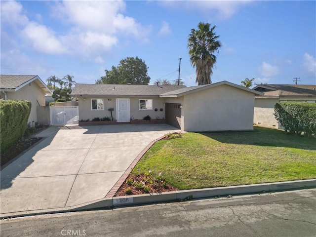 ranch-style home with a front lawn