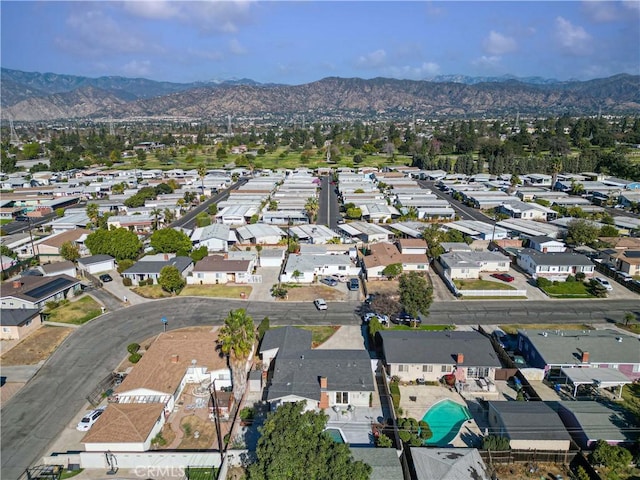 birds eye view of property with a mountain view