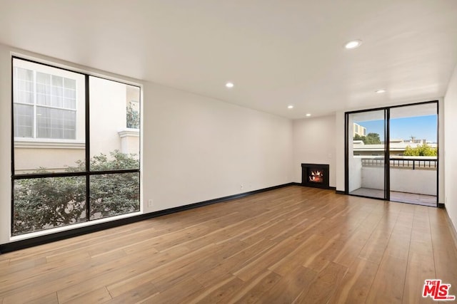 spare room with light hardwood / wood-style floors