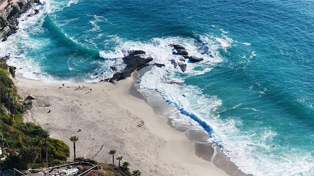 bird's eye view featuring a water view and a view of the beach