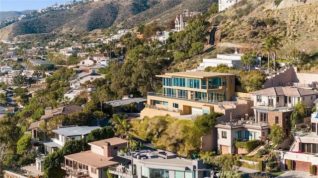 birds eye view of property with a mountain view