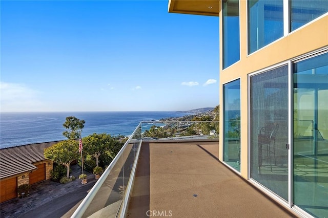 balcony featuring a water view