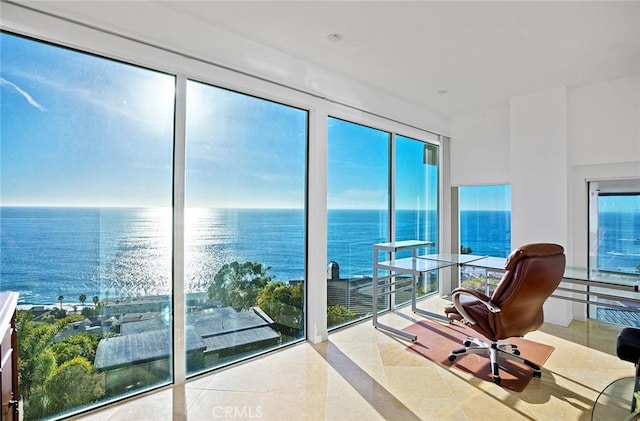 interior space featuring a water view and light tile patterned flooring