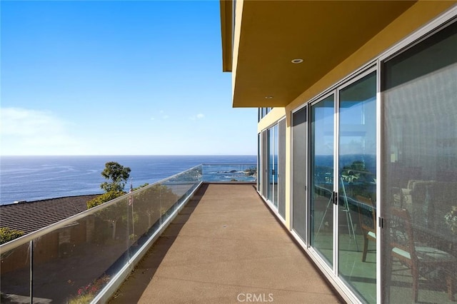 balcony featuring a water view