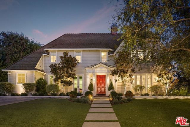 view of front of home with a lawn