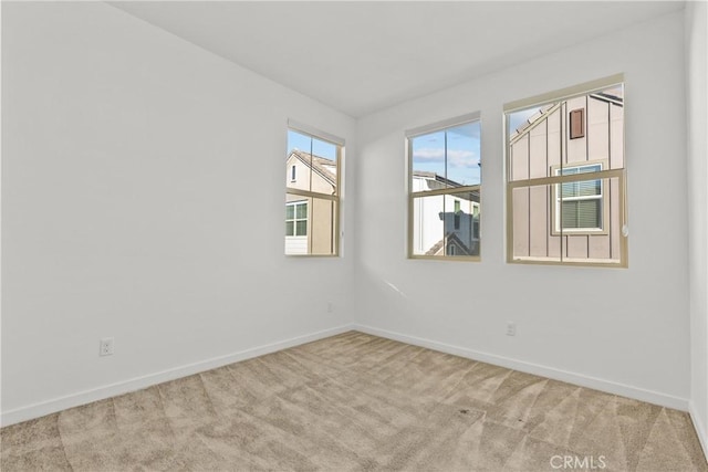 empty room featuring light colored carpet