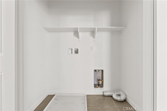 laundry area with hookup for an electric dryer, laundry area, tile patterned floors, baseboards, and hookup for a washing machine