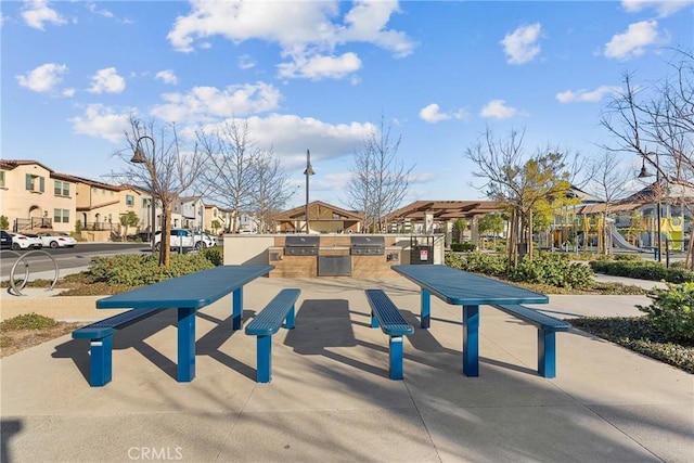 view of property's community with exterior kitchen and a residential view