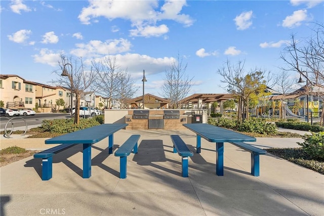 surrounding community with exterior kitchen and a residential view