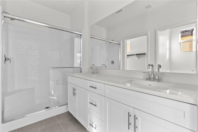 15992 Jamie Ln Unit 1, Fontana, CA 92336 - bathroom featuring double vanity, a shower stall, and tile patterned flooring