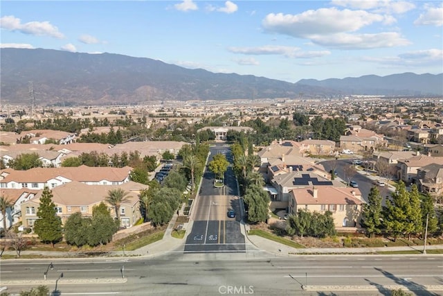 birds eye view of property with a mountain view and a residential view