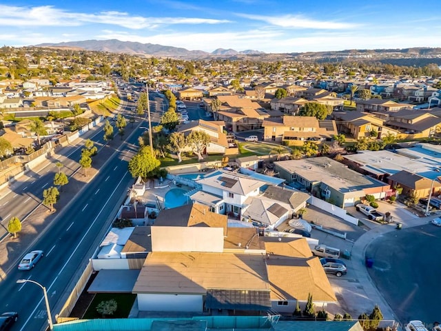 birds eye view of property with a mountain view