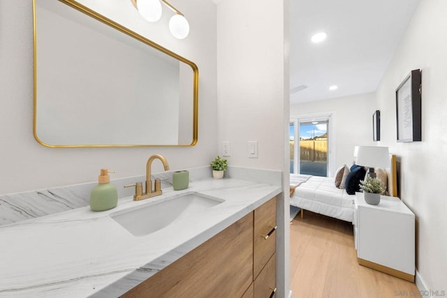 bathroom featuring vanity and hardwood / wood-style floors