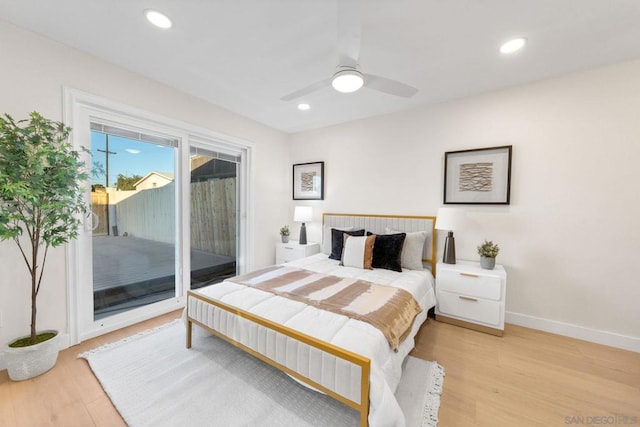 bedroom featuring access to exterior, ceiling fan, and light hardwood / wood-style floors