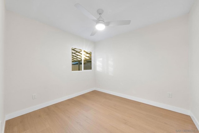 unfurnished room with ceiling fan and light wood-type flooring