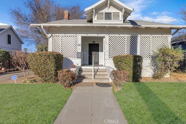 bungalow with a front yard