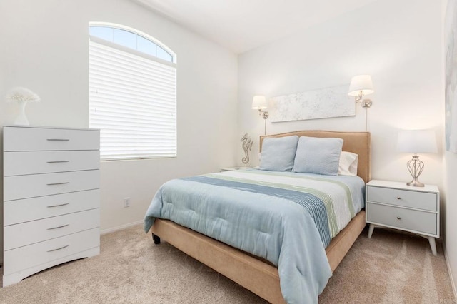 bedroom with light carpet