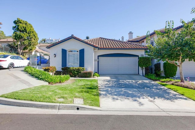 view of front of property with a front lawn and a garage