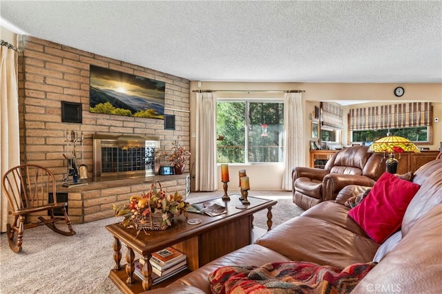 living room with carpet floors, a textured ceiling, and a brick fireplace