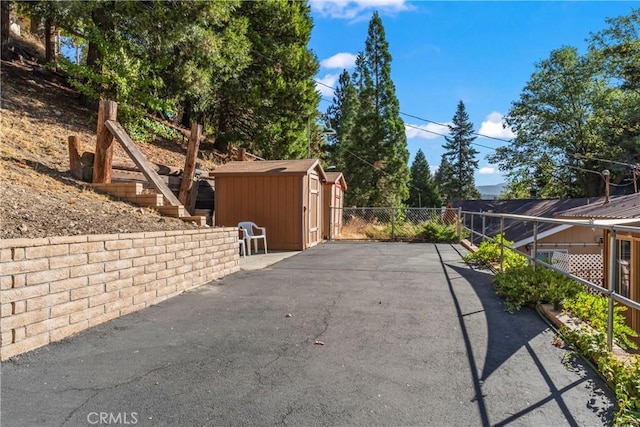 exterior space with a storage shed