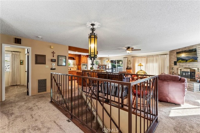 interior space featuring carpet and a textured ceiling