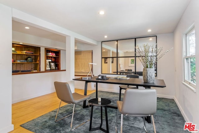 dining space featuring wood-type flooring