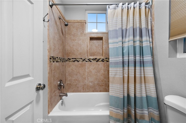 bathroom with toilet and shower / tub combo